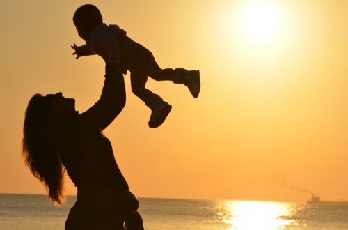 woman letting go of child
