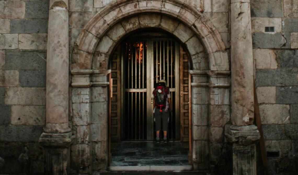 pilgrim at church door